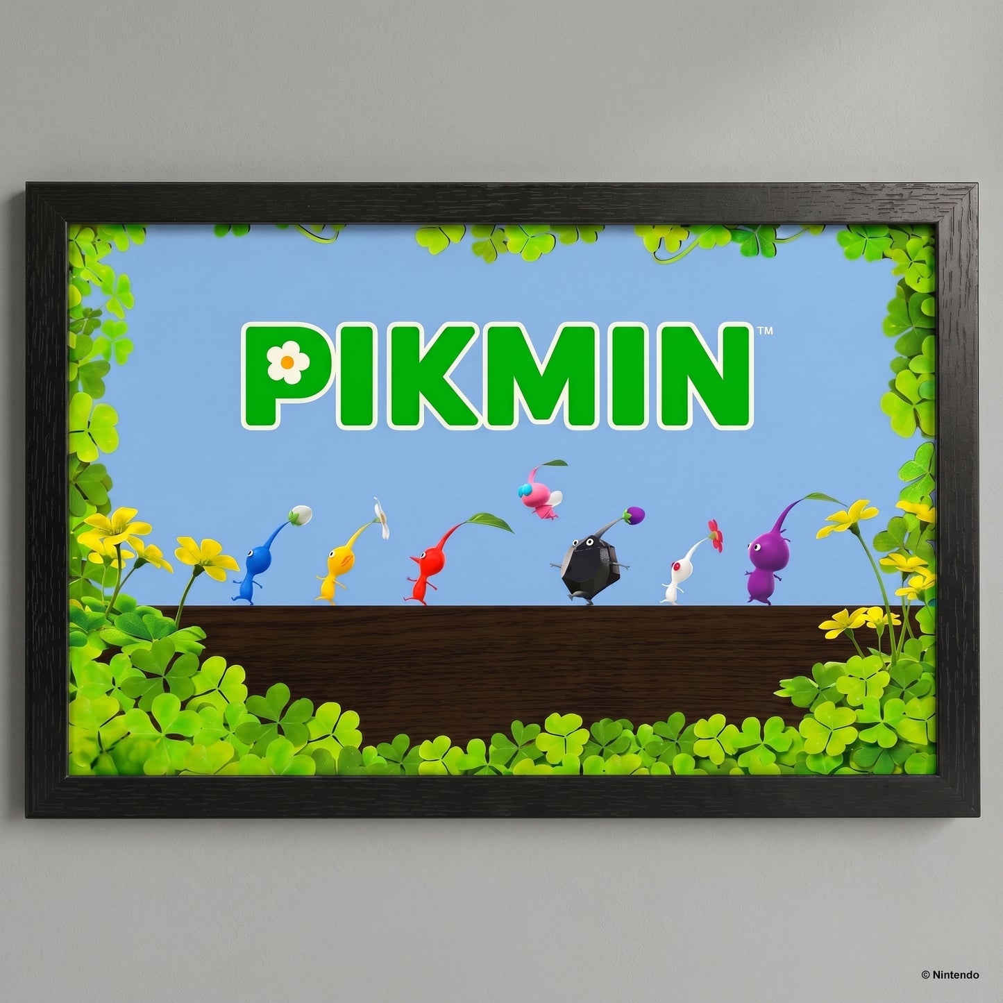 Framed artwork of Pikmin characters with the word 'Pikmin' on a blue background.